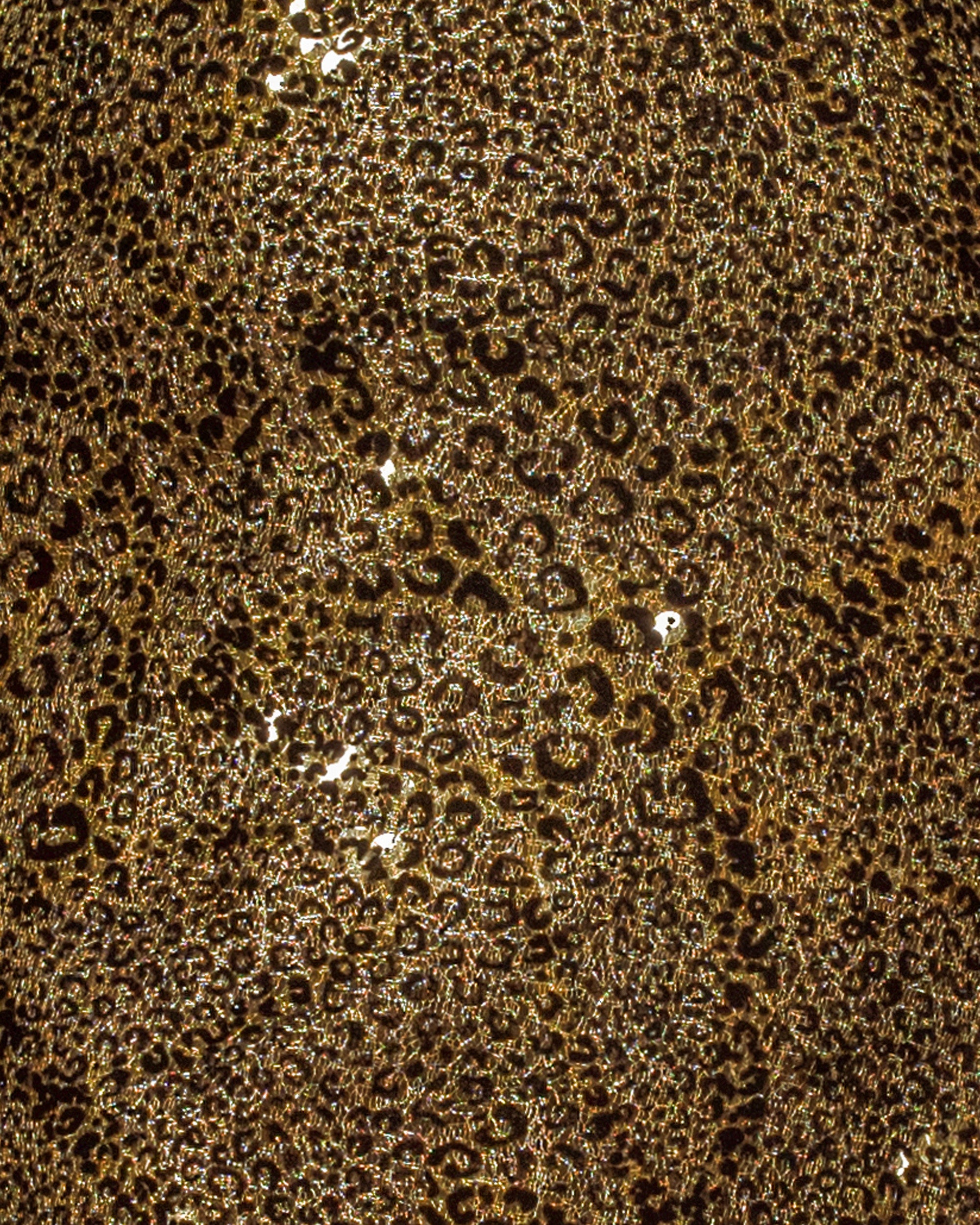 A close-up of an olive sequined organza