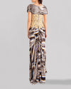 The back of a long multicolored evening dress featuring short sleeves and an embroidered lace bodice.