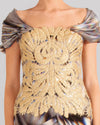 A close-up of a multicolored evening dress featuring short sleeves and an embroidered lace bodice.