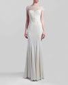 A long ivory dress featuring a lace bodice with short-sleeves.