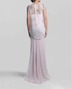 The back of a long strapless pink evening dress paired with an overlay lace top.