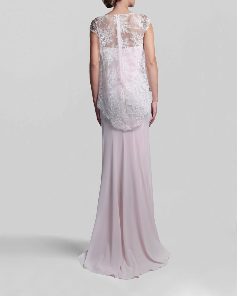 The back of a long strapless pink evening dress paired with an overlay lace top.