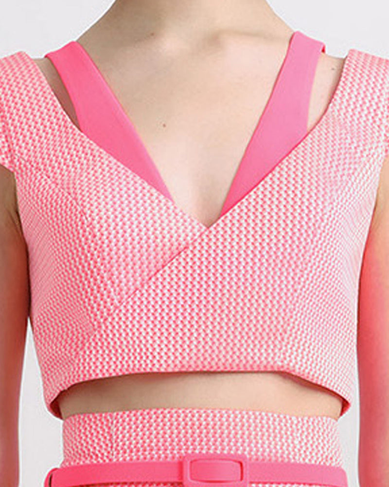 A two tone pink cropped jacquard top with cut out details.